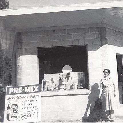 Ken's grandmother Marie in front of a new store, 1957